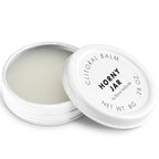 Baume clitoridien Horny Jar Bijoux Indiscrets, pot blanc ouvert laissant voir la texture cremeuse, couvercle pose a cote, cosmetique stimulant 8 g sur fond blanc