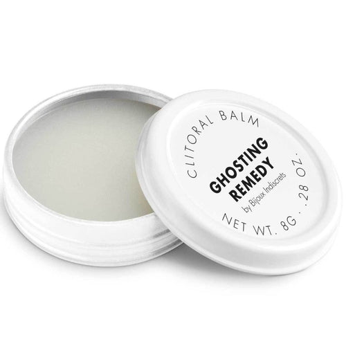 Baume clitoridien Ghosting Remedy Bijoux Indiscrets, pot blanc ouvert montrant la texture, couvercle a cote, cosmetique stimulant chauffant 8 g sur fond blanc
