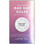 Etui violet du baume clitoridien Bad Day Killer Bijoux Indiscrets, texte The best is yet to come, packaging du cosmetique chauffant 8 g sur fond blanc