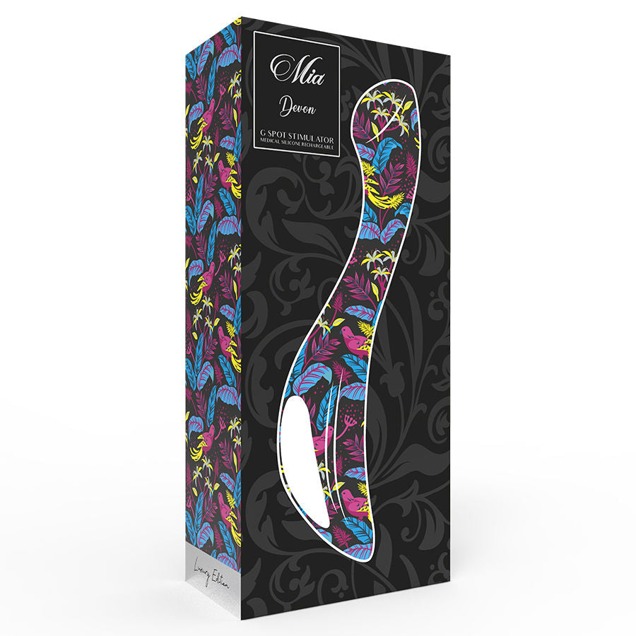 Boite noire decorative du vibromasseur point G Devon, illustrant le sextoy silicone sur fond fleuri colore, avec mention de la marque Mia et de la gamme stimulateur point G.