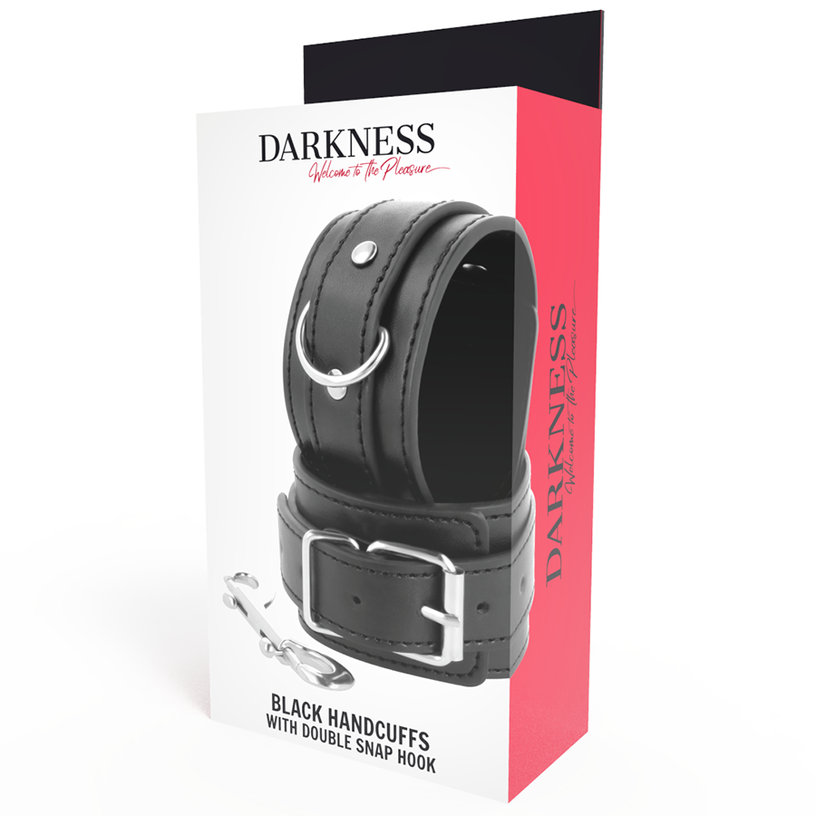 Boite Darkness Black Handcuffs with Double Snap Hook de face, menotte cuir noir a anneau en D, packaging rouge et blanc pour le bondage des poignets.
