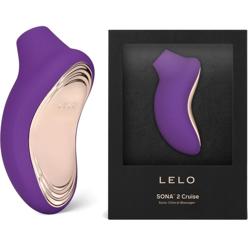 Stimulateur clitoridien Sona 2 Cruise violet présenté près de sa boîte Lelo Sonic Clitoral Massager, masseur sonique en silicone à embout d'aspiration arrondi.