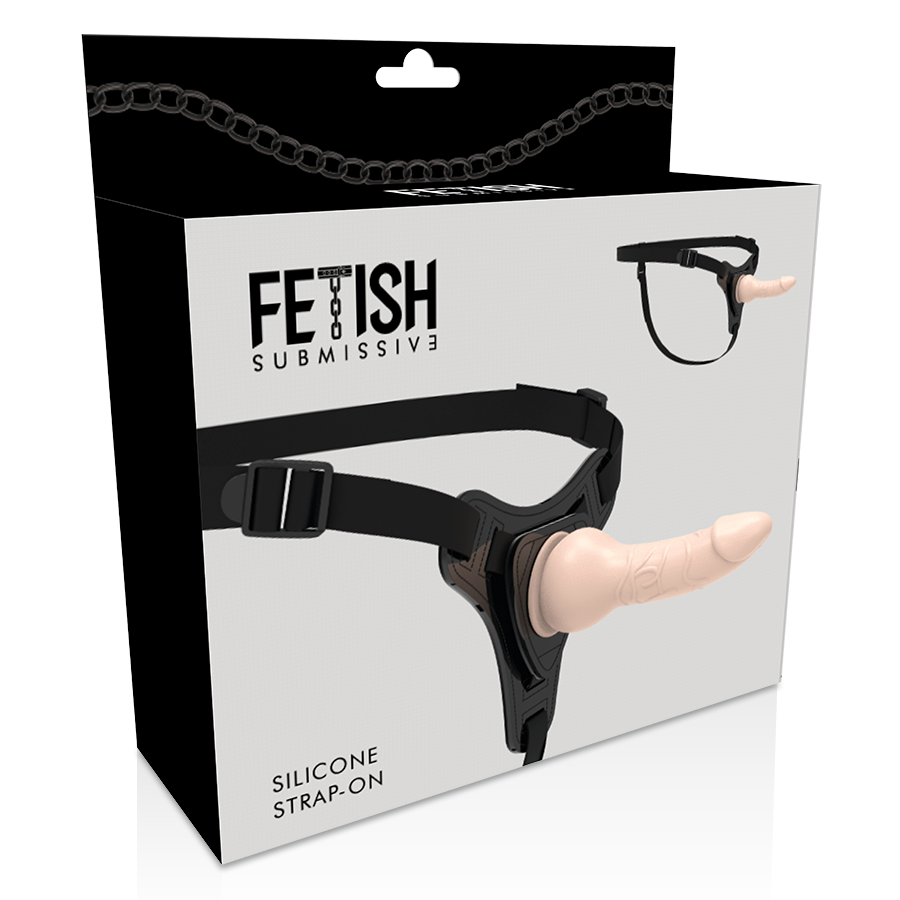 Boite Fetish Submissive du strap-on silicone, vue d'angle montrant le harnais noir et son gode chair realiste, ensemble reglable pour le jeu en couple.