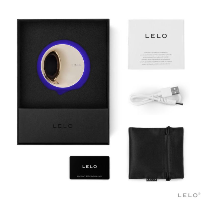 Coffret Lelo Ora 3 bleu ouvert avec notice, cable USB, carte de garantie et pochette noire, simulateur de plaisir oral a disque rotatif dore en silicone biocompatible.