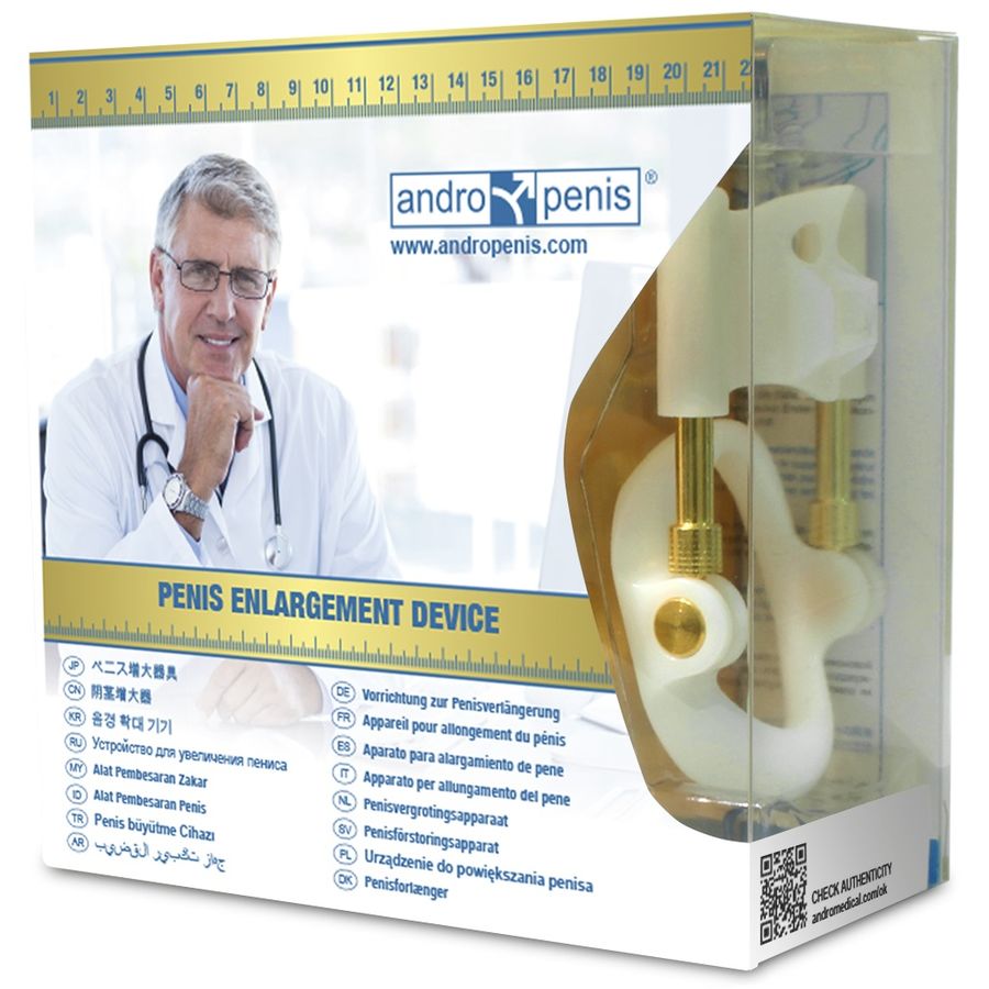 Boite de l'extenseur a finition doree de face, emballage transparent avec photo de medecin et mention Penis Enlargement Device, dispositif de traction mecanique non chirurgical