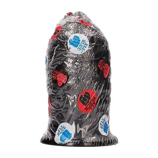 Plug anal nervure All Black sous film plastique a pastilles, silhouette en ogive striee devinee au travers du film, silicone noir etanche de 16 cm a la texture marquee.