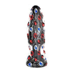 Plug anal All Black 35 cm en PVC, variante decorative noire mouchetee de paillettes rouges et bleues, profil allonge pour un etirement anal progressif des pratiquants avances.