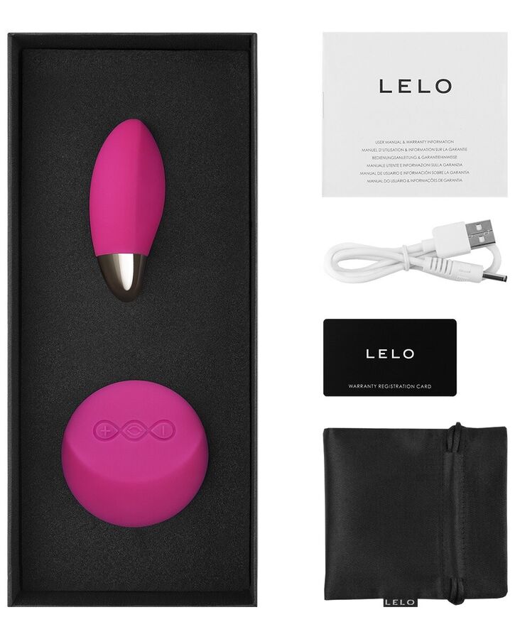 Œuf vibrant Lyla 2 de Lelo rose dans son écrin avec ses accessoires : câble USB, carte de garantie, pochette satinée et manuel d'utilisation.