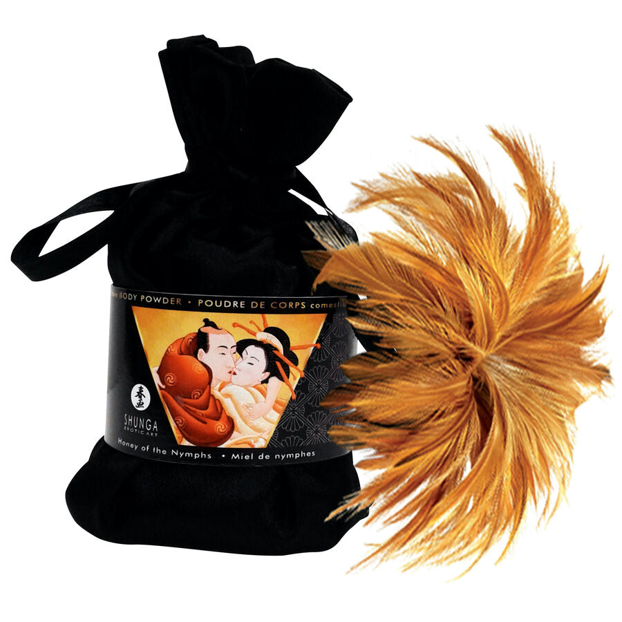Poudre de massage comestible Shunga dans sa pochette en velours noir avec pinceau plume orange, massage sec sensuel et gourmand sans sensation grasse à saupoudrer.