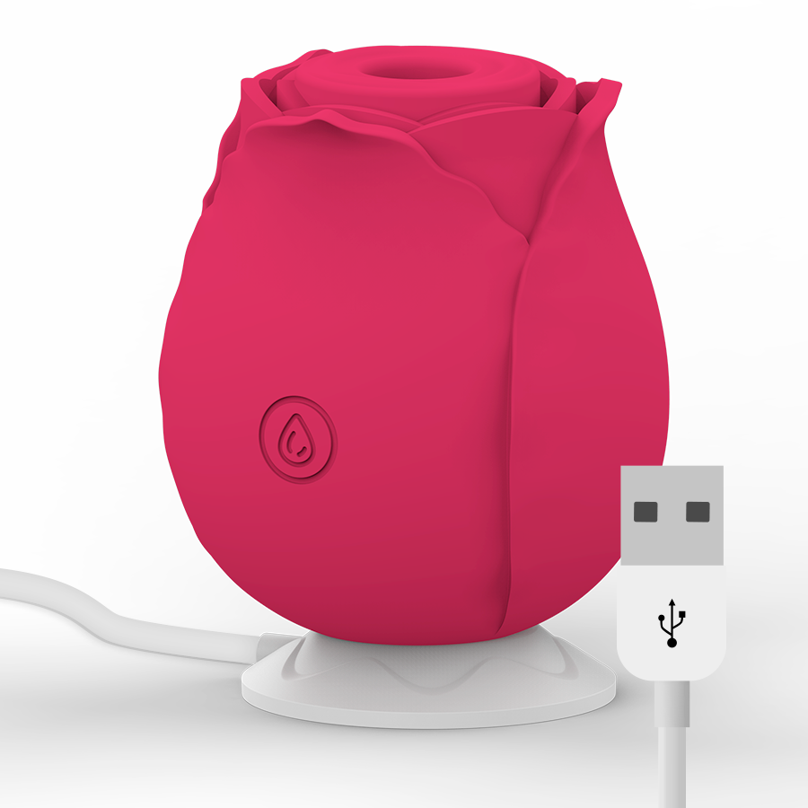 Stimulateur clitoridien par succion en forme de rose framboise avec son socle de charge et cable USB, vue d'ensemble du sextoy silicone rechargeable agissant par ondes d'air.