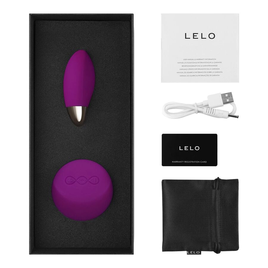 Œuf vibrant Lyla 2 de Lelo fuchsia dans son écrin noir, accompagné du manuel, du câble USB, de la carte de garantie et de la pochette satinée.
