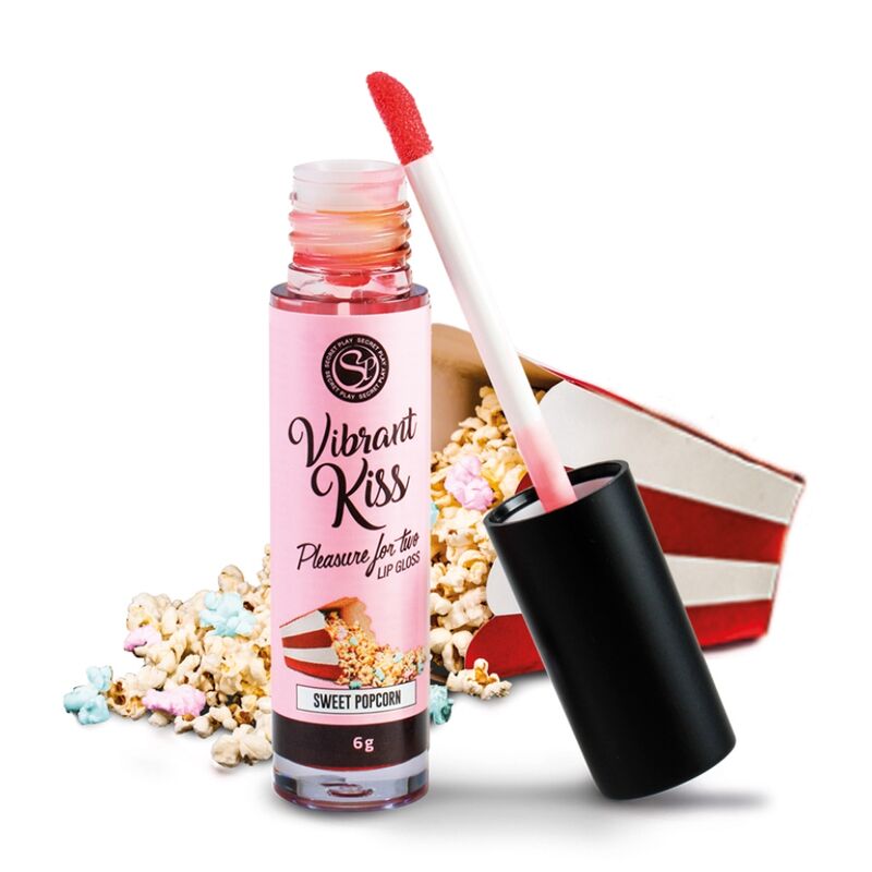 Gloss a levres vibrant Vibrant Kiss saveur popcorn sucre de Secret Play, tube rose et applicateur, effet picotement sur les levres, decor de popcorn caramelise.