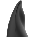 Gros plan sur la pointe du stimulateur Coquette noir, format galet pour une stimulation externe vibrante et ciblée.