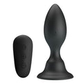 Plug anal vibrant Mr Play en silicone noir avec sa telecommande sans fil : corps en ogive a col etroit et base ventouse, 12 modes etanches pilotables a distance.