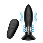 Plug anal Mr Play en silicone noir aux ondes de vibration stylisees, billes rotatives internes visibles et telecommande sans fil, rotation et vibration rechargeables etanches.