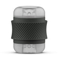 Masturbateur compact Bhandy : gaine translucide texturée serrée dans un manchon noir antidérapant. Vue de face du cylindre, texture interne visible, aucun moulage réaliste.