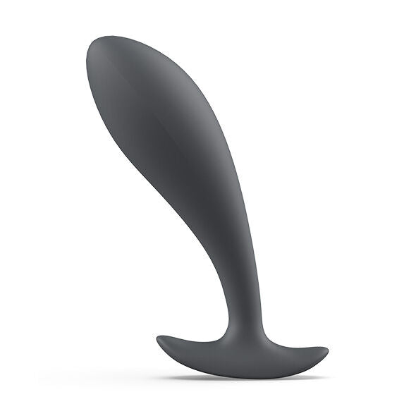 Plug prostatique fin anthracite à tête effilée et col mince, base plate évasée stabilisante. Profil élancé en silicone lisse posé sur fond blanc, contour épuré sans anatomie.