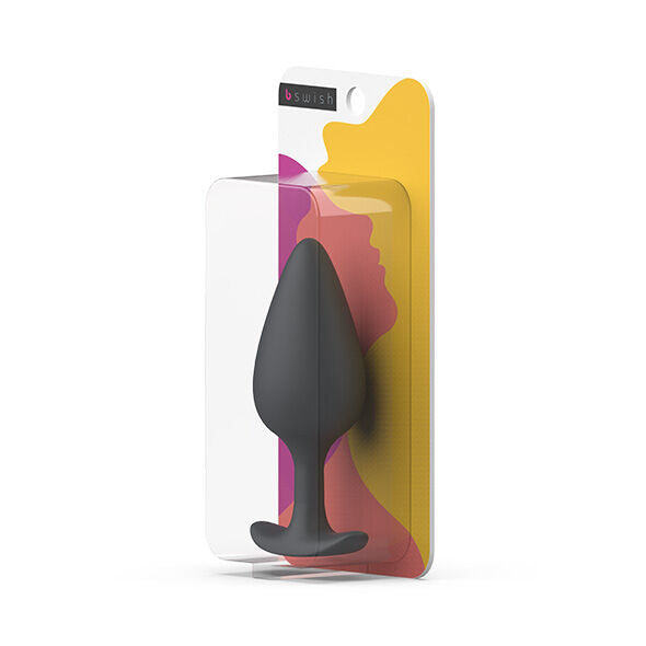 Plug prostatique anthracite présenté sous blister B Swish jaune et rose. Vue du produit lisse maintenu dans sa coque transparente accrochée à la carte colorée.