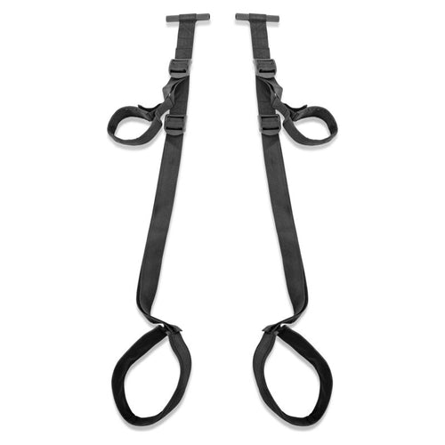 Balancoire de porte Fetish Fantasy presentee a plat : sangles noires reglables et larges supports de cuisses rembourres, sans modele ni decor.