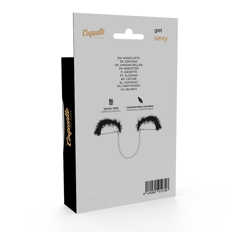 Boite blanche des menottes Coquette en metal sans nickel, avec visuel produit et plumeau noir, accessoire de bondage leger feminin pour debuter les jeux d'attache en couple.