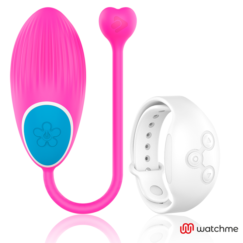 Oeuf vibrant Wearwatch fuchsia en silicone medical avec cordon en coeur et bouton fleur, a cote de sa montre telecommande blanche, controle sans fil au poignet