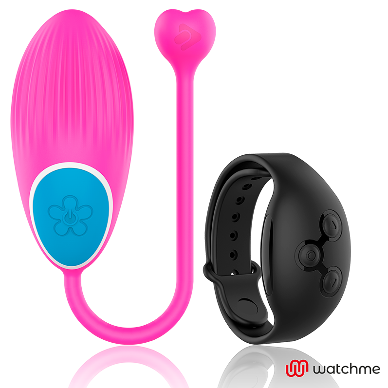 Oeuf vibrant Wearwatch fuchsia en silicone medical avec cordon en coeur et bouton fleur, a cote de sa montre telecommande noire, pilotage sans fil au poignet