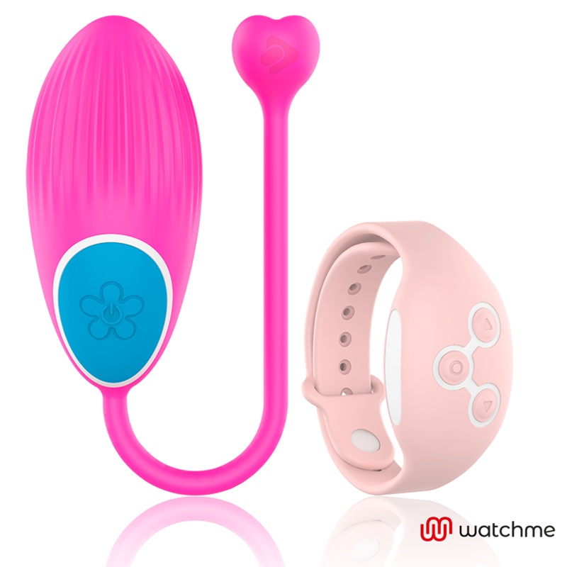 Oeuf vibrant Wearwatch fuchsia en silicone medical avec cordon en coeur et bouton fleur, a cote de sa montre telecommande rose poudre, controle sans fil au poignet